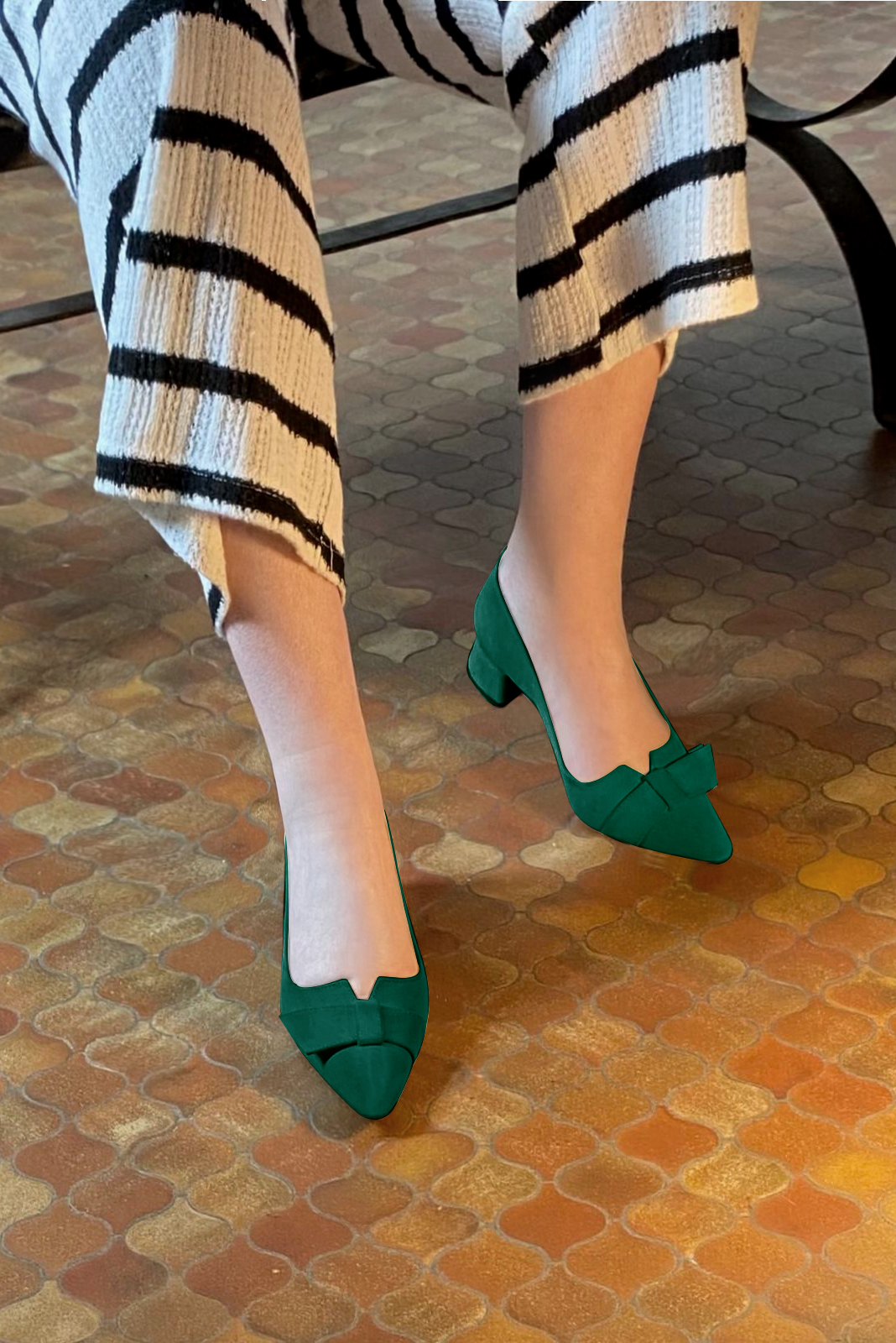 Forest green women's dress pumps, with a knot on the front. Tapered toe. Low flare heels. Worn view - Florence KOOIJMAN